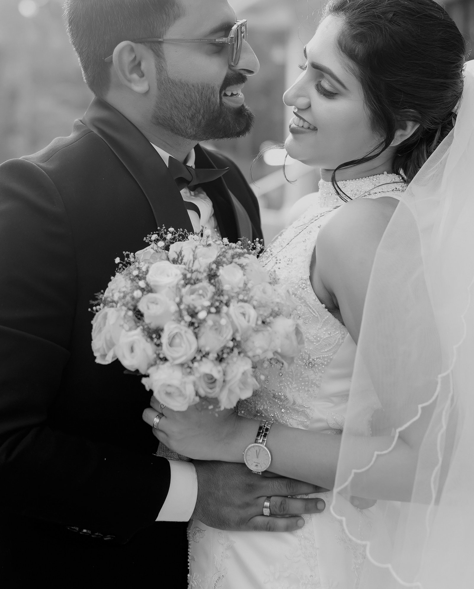 Black-and-white close portrait of newlyweds