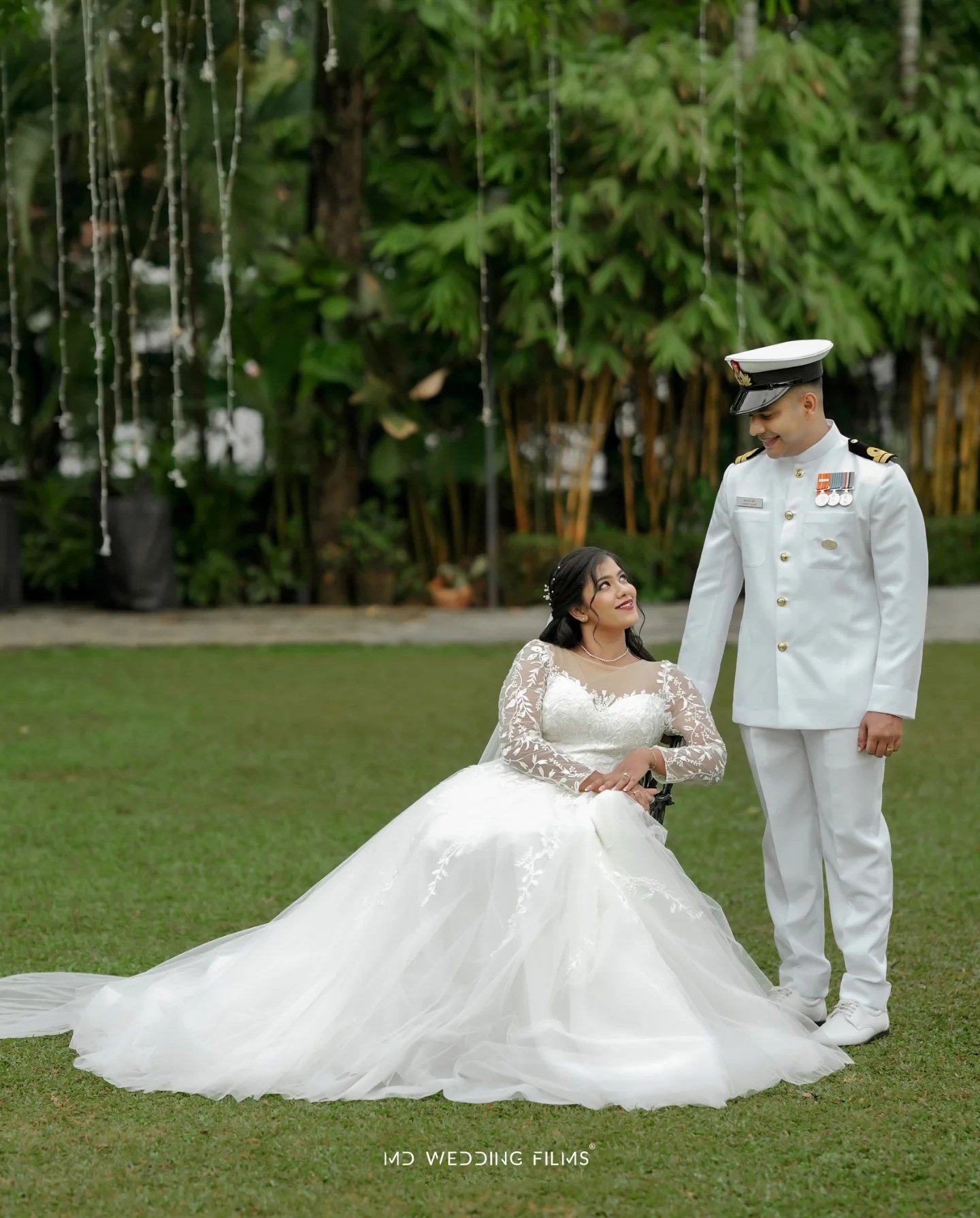 Bride and groom sharing a quiet look in the garden
