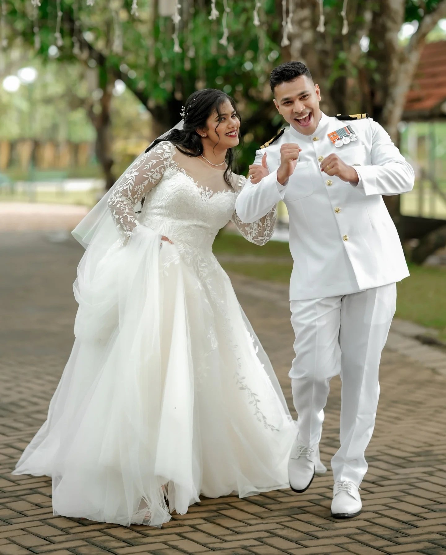 Newlyweds sharing a playful moment outdoors