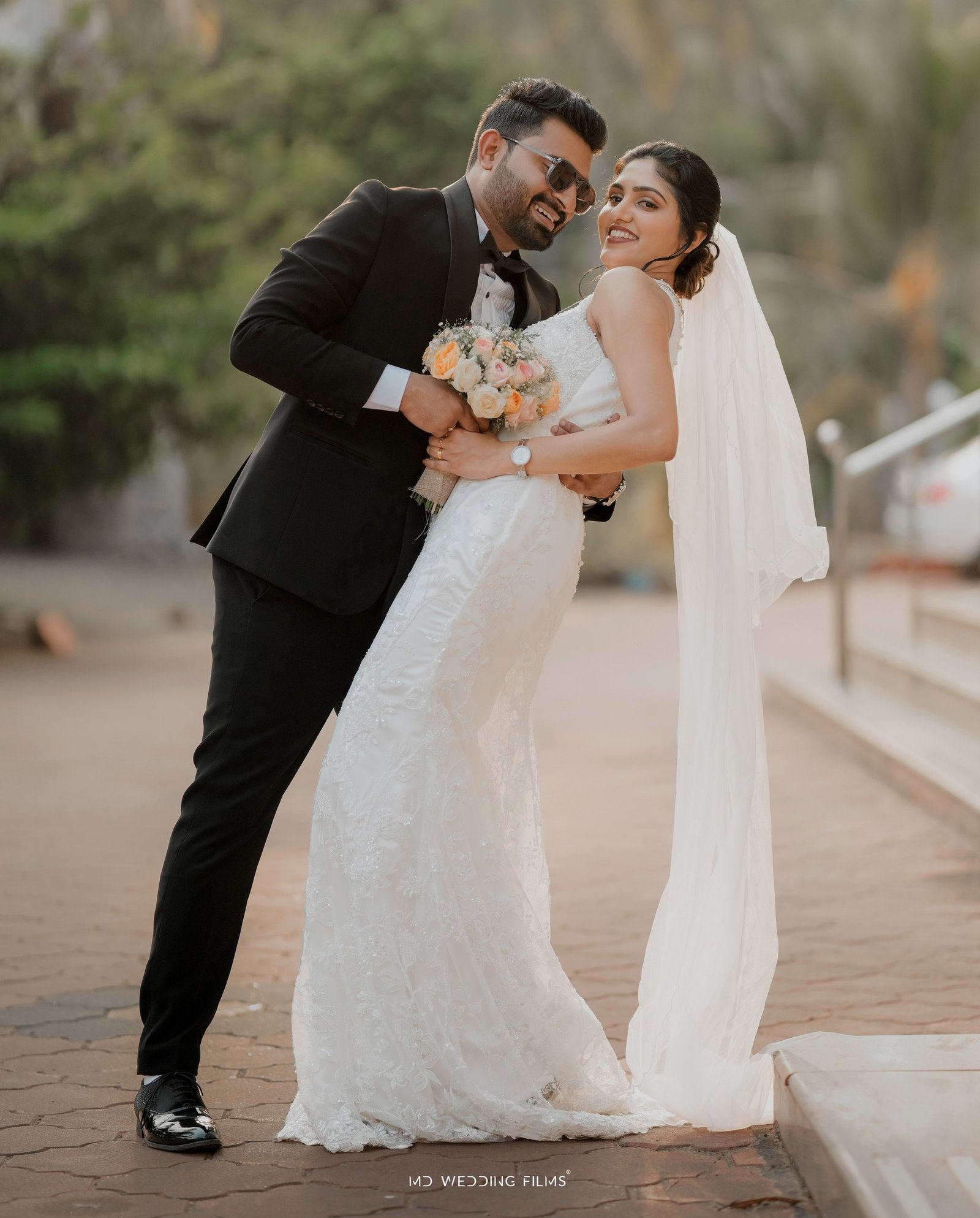Newlyweds sharing an elegant outdoor portrait
